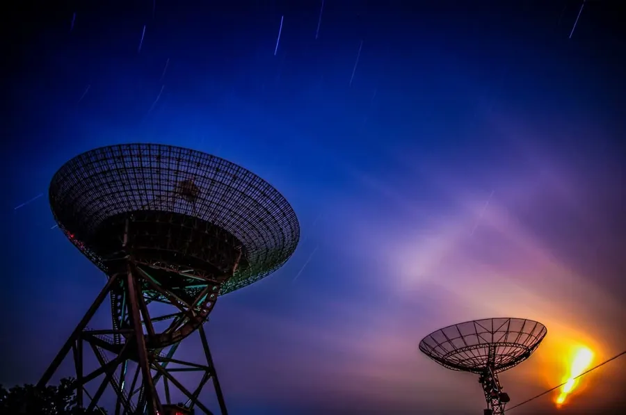 Satellite dishes at sunset